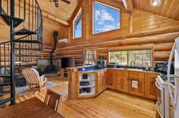 Cozy log cabin with loft, deck & rustic charm!